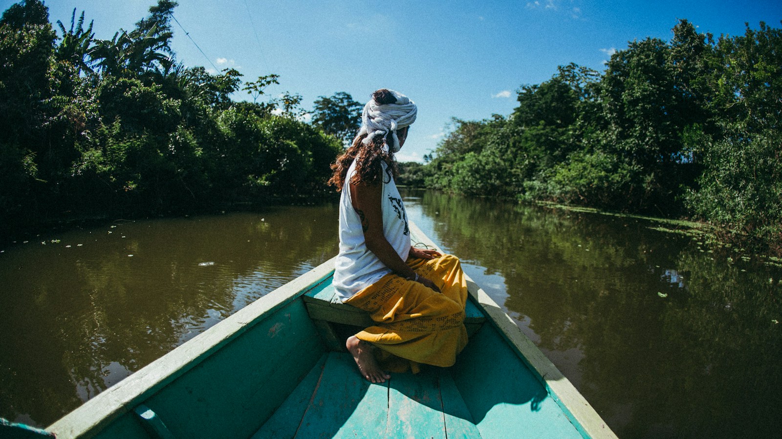 woman riding on boat at river