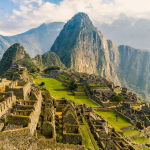 a large ancient city with Machu Picchu in the background